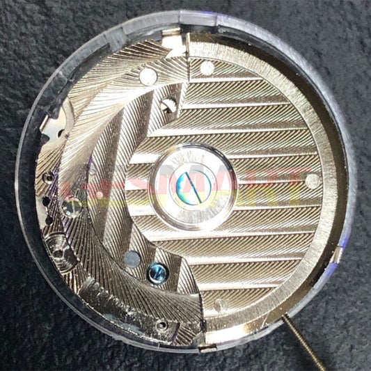 China Made watch accessory featuring automatic mechanical movement and reversed balance wheel with big date display at 12 o'clock.