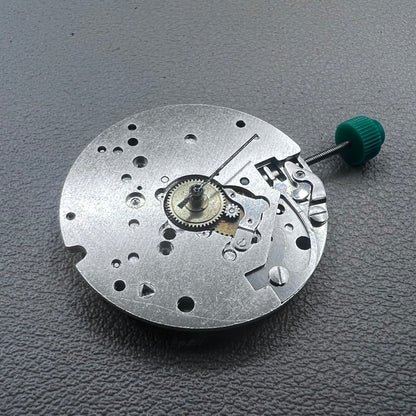 Swiss ETA 6640B quartz watch movement with 3 hands and black circuit board for precise timekeeping.