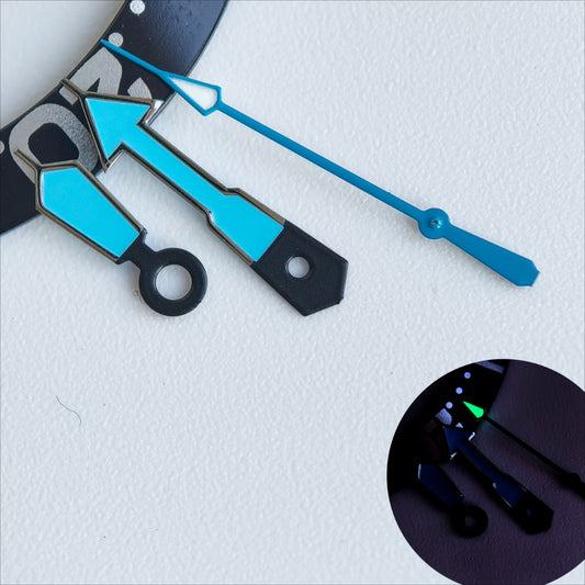 Dark silver-trimmed blue painted watch hands with green lume for NH35/36, enhancing visibility and style.