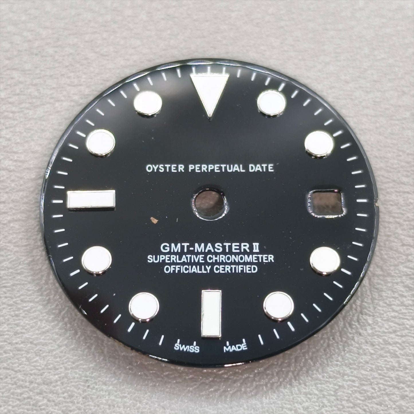 watch dial with R logo