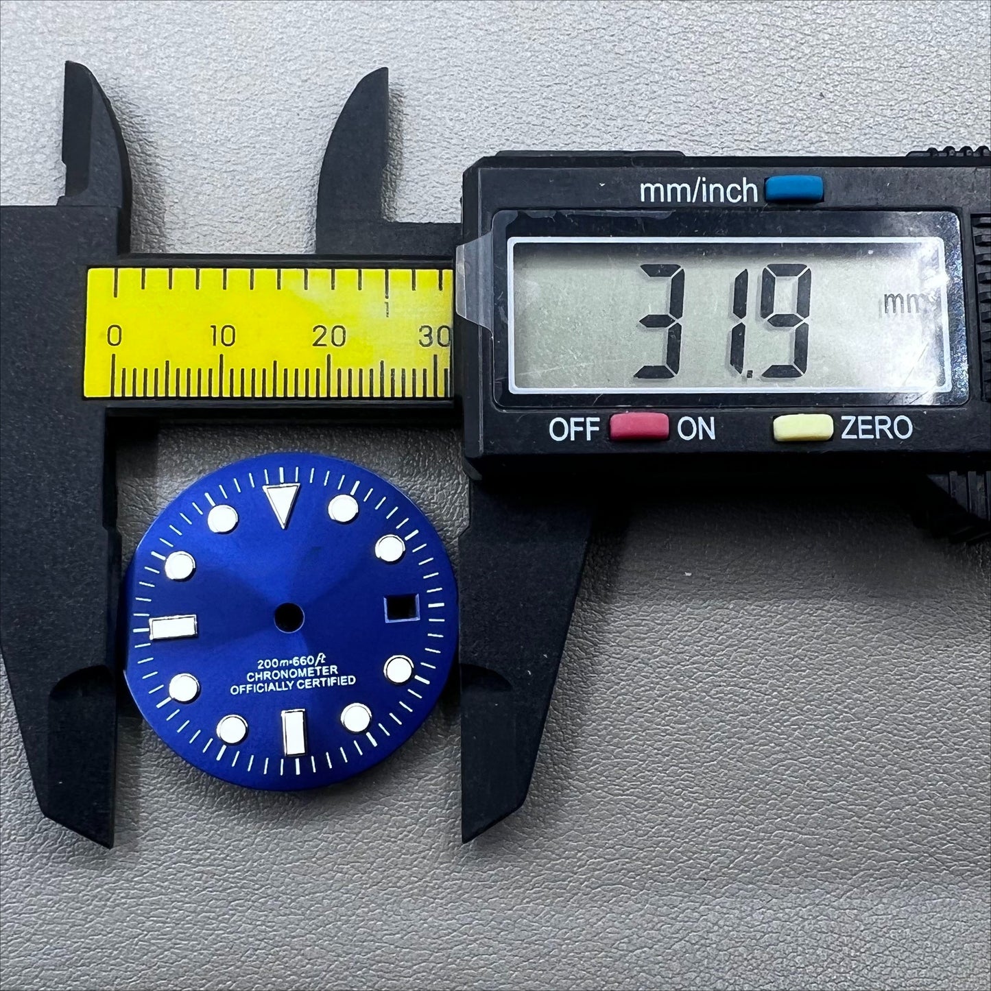 Blue 32mm GMT diving watch dial with green luminous markers for NH34 movement.