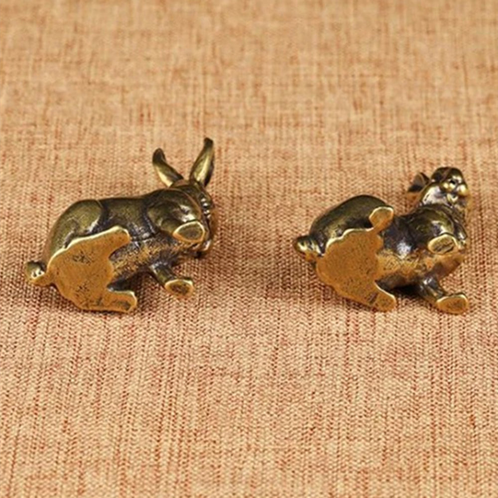 Vintage hand-carved bronze rabbit figurine set, solid copper decor trinkets for elegant watch accessory display.