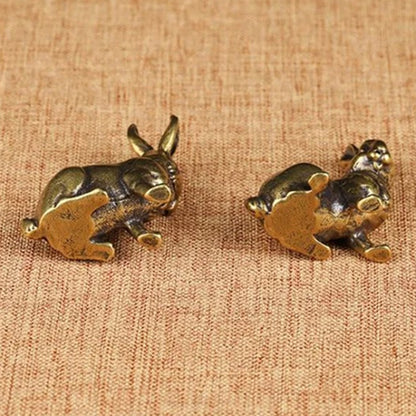 Vintage hand-carved bronze rabbit figurine set, solid copper decor trinkets for elegant watch accessory display.