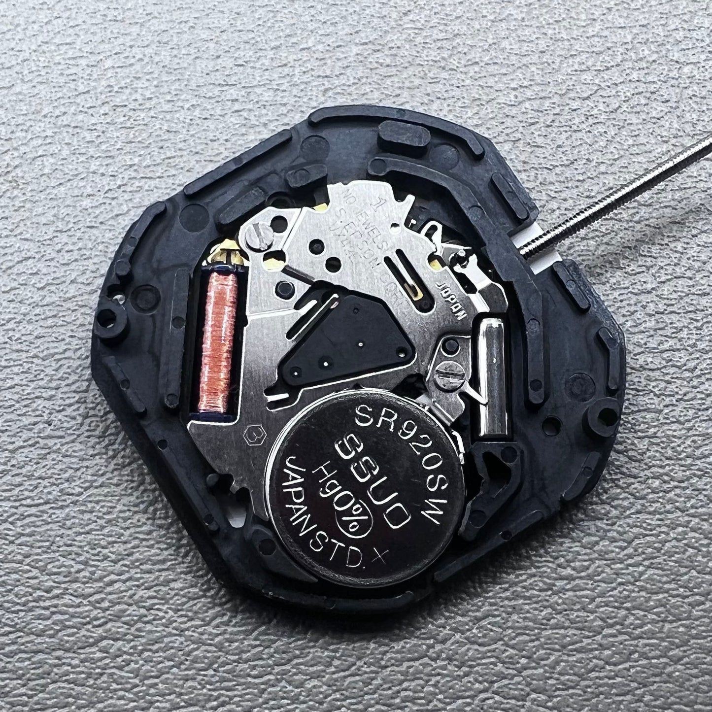 Japan Hattori Epson VX42E quartz watch movement with date display at 6 o'clock, precision timing.