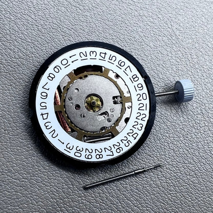 Swiss Ronda 715 quartz watch movement with date display at 3 o'clock, precision timing for accessories.