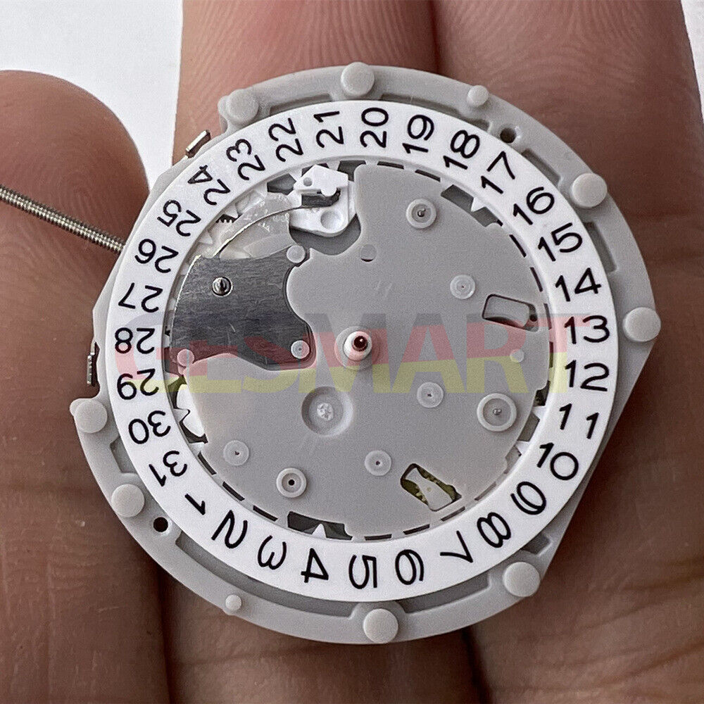 Sunon PE70 quartz watch movement with 3 hands, date at 3, and small seconds at 3, 6, and 9 positions