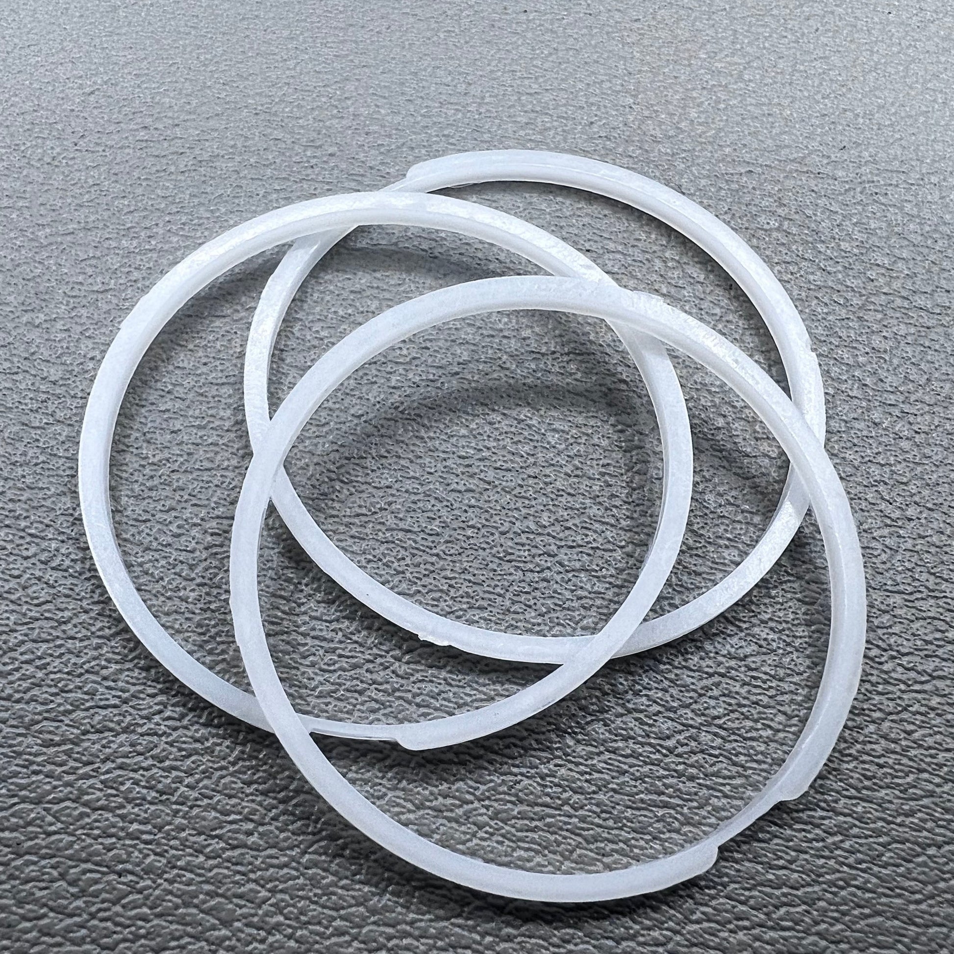 White cushion mount spacer rings set of 3 for 7009 movement watches, precision fit.