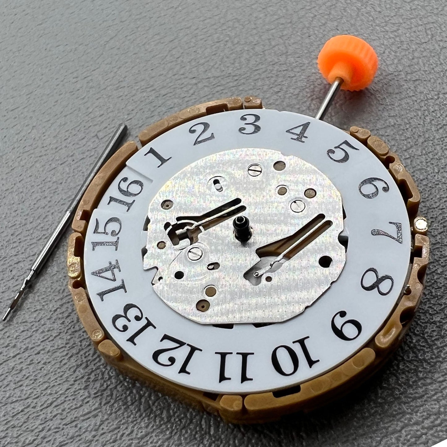 Japan Miyota GP00 quartz watch movement close-up, precision timekeeping mechanism for watches.