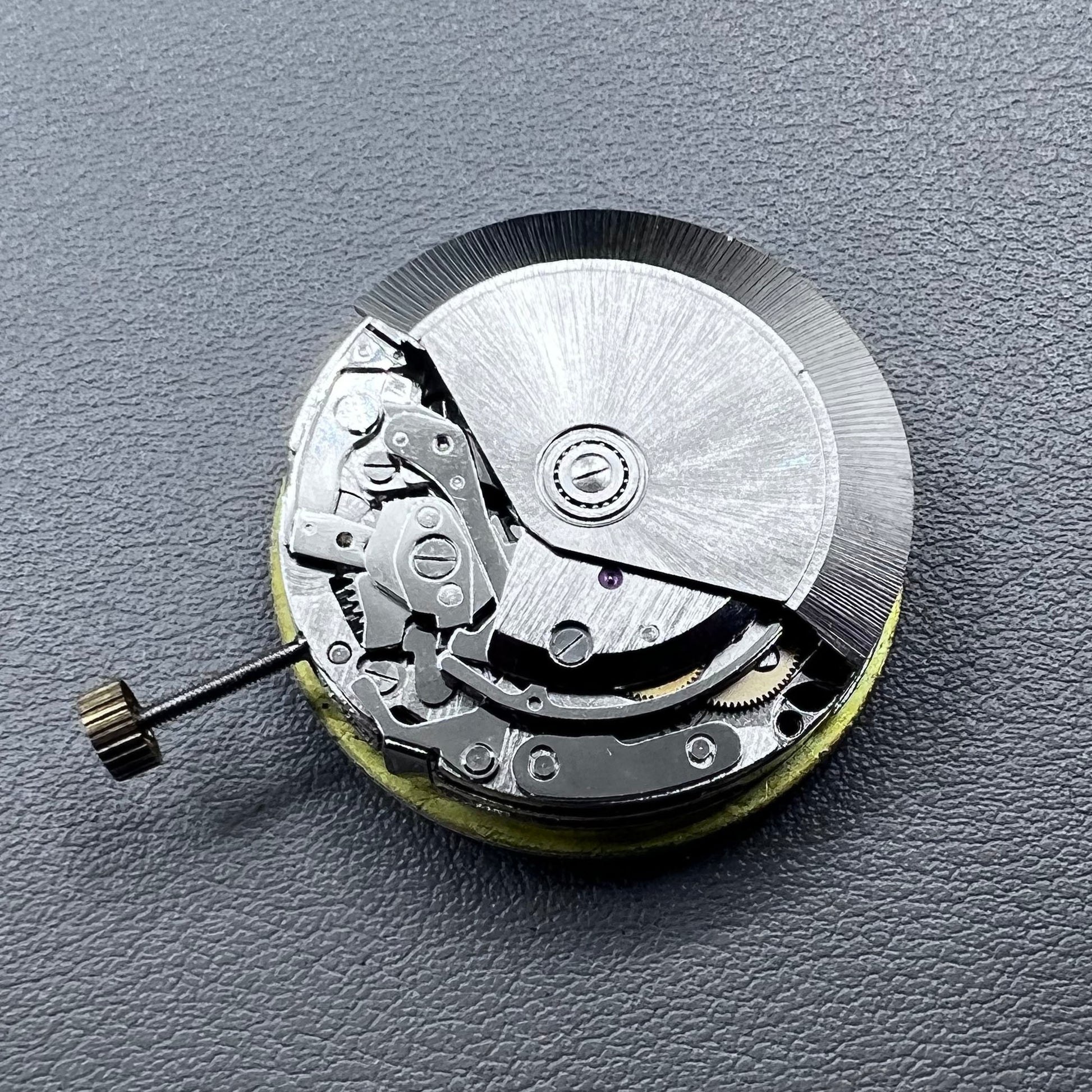 Shanghai 7750 mechanical watch movement with single calendar and small second at 9 o'clock, precision timekeeping.