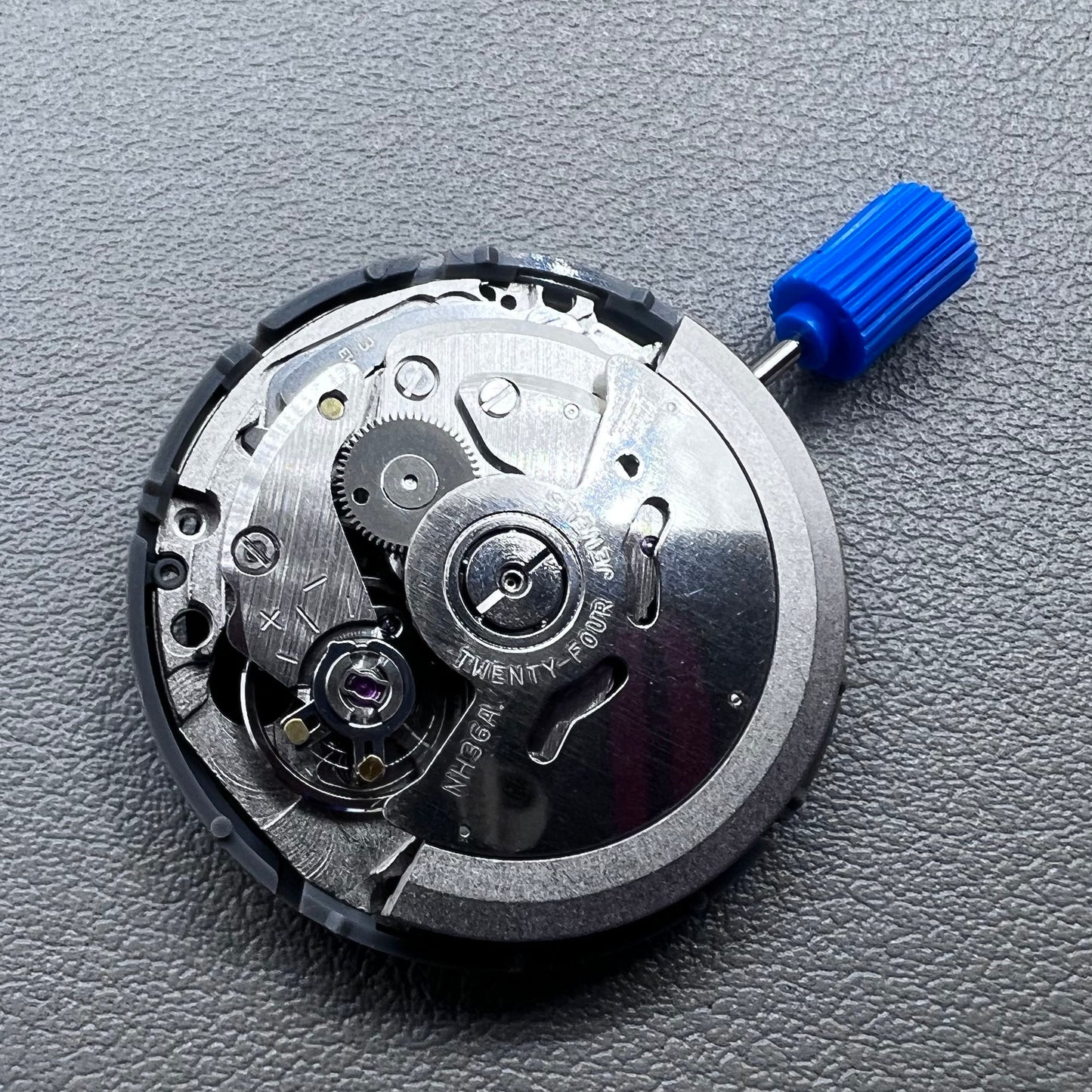 Seiko NH36A automatic movement with black Roman wheel crown, precise watch accessory for mechanical timepieces.