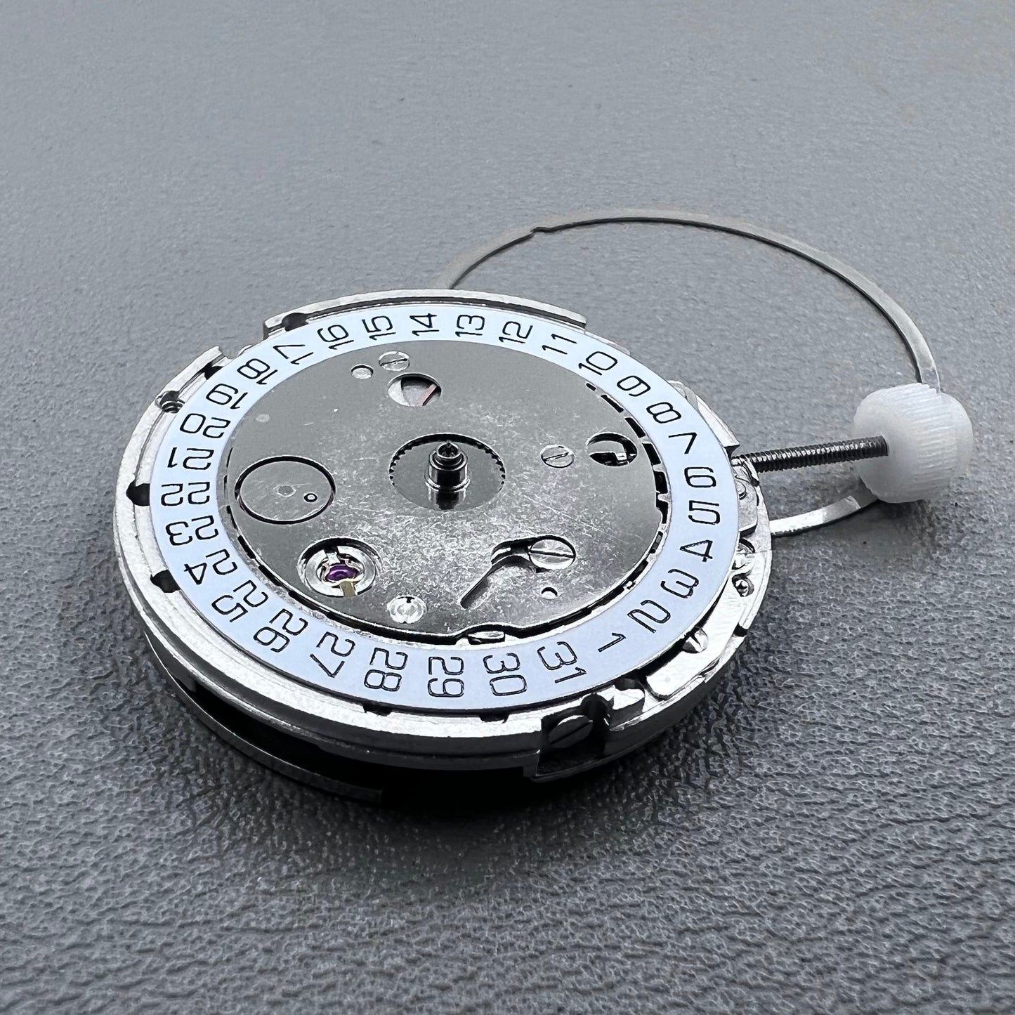 Silver plated DG2813 automatic watch movement with large and small hands, date display at 3 o'clock