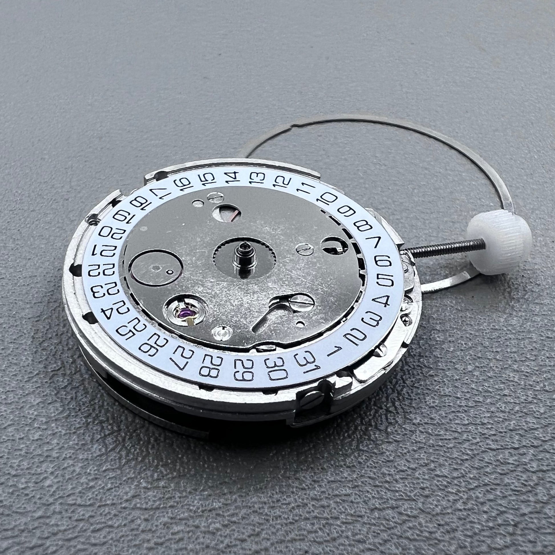 Silver plated DG2813 automatic watch movement with large and small hands, date display at 3 o'clock