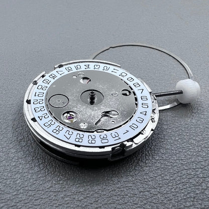 Silver plated DG2813 automatic watch movement with large and small hands, date display at 3 o'clock