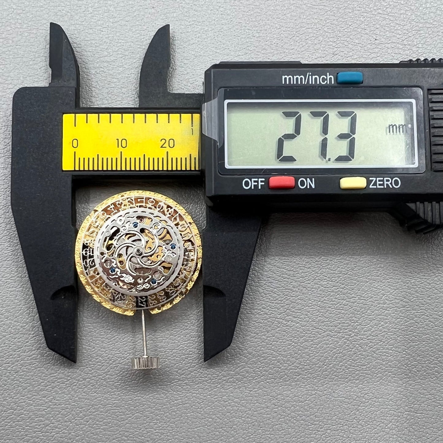 Golden Hangzhou 2189 mechanical calendar watch movement showcasing intricate hollow design and precise craftsmanship.