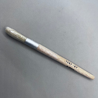 Swiss Bergeon 1307-02 white bristle brush for delicate watch cleaning and maintenance.