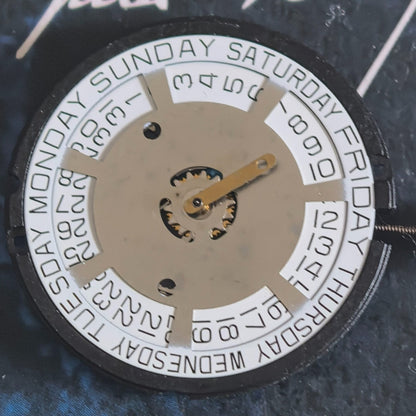 Swiss Made ETA805.144 quartz watch repair part with three white hands and disk for precise timekeeping.