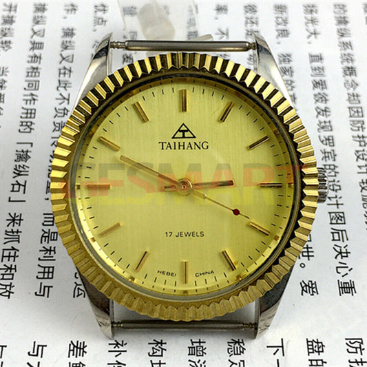 38mm TAIHANG manual mechanical watch with golden dial, nail markers, round case, 17 jewels.