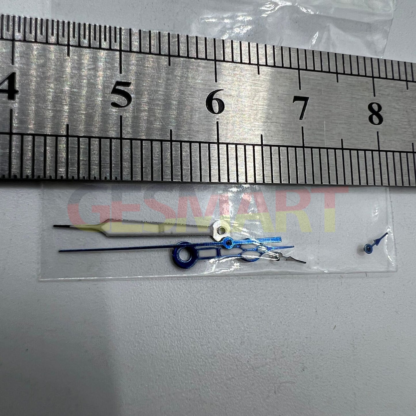 Blue-trimmed green lume watch hands for Miyota OS10 movement, enhancing style and night visibility.