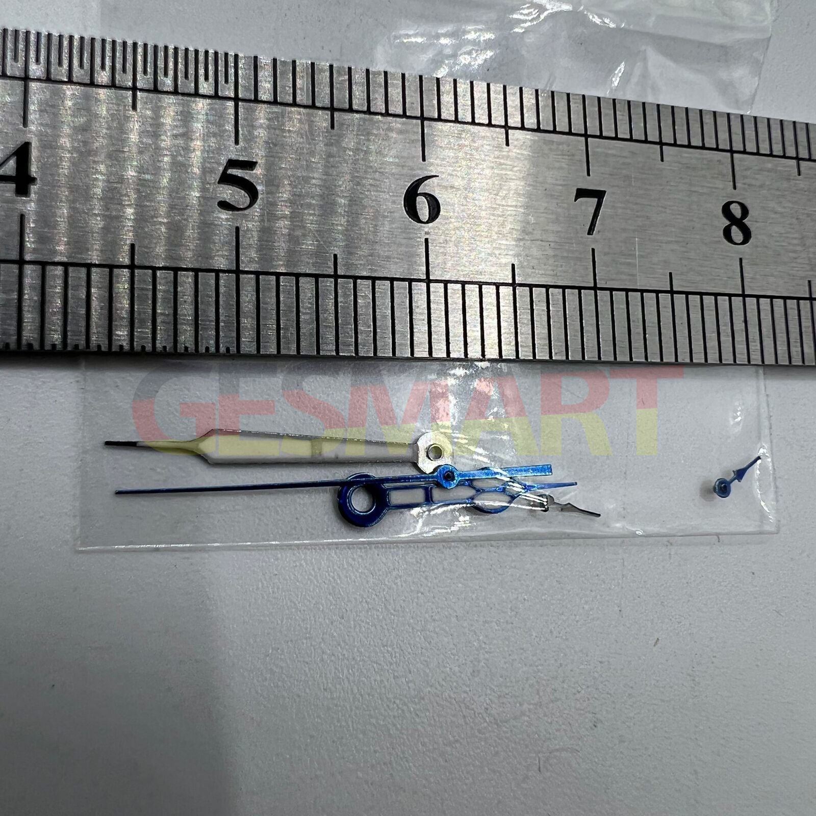 Blue-trimmed green lume watch hands for Miyota OS10 movement, enhancing style and night visibility.