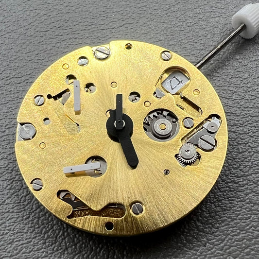 Swiss ISA 9232 quartz watch movement with six hands, date at 3, small seconds at 6/9/12, precision timekeeping.