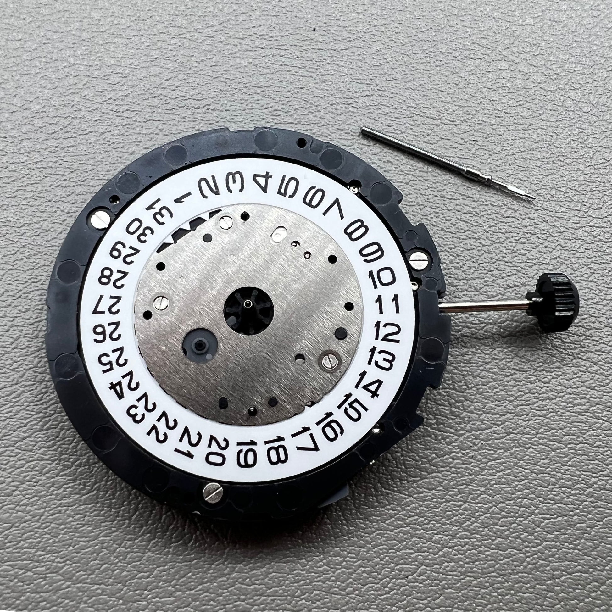 Japan Miyota 6S11 quartz watch movement featuring 2 hands, date at 3, small seconds at 6 and 12 positions.