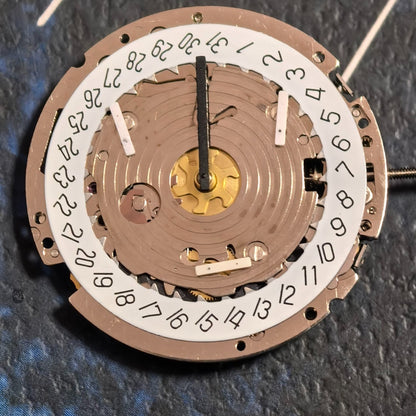 Swiss ISA 8171A quartz watch movement with 6 hands and white date disk at 4 o'clock, ideal for repairs.