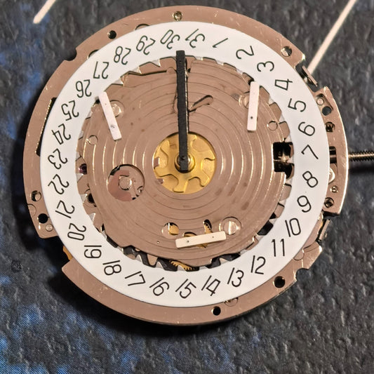 Swiss ISA 8171A quartz watch movement with 6 hands and white date disk at 4 o'clock, ideal for repairs.