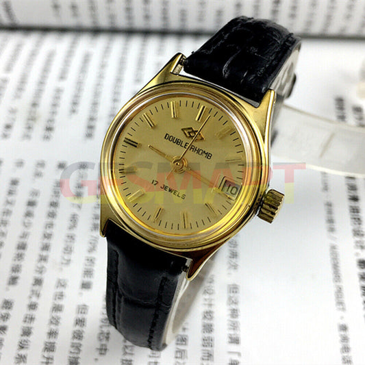 Double Rhomb lady watch with golden dial, manual mechanical movement, and single calendar display.