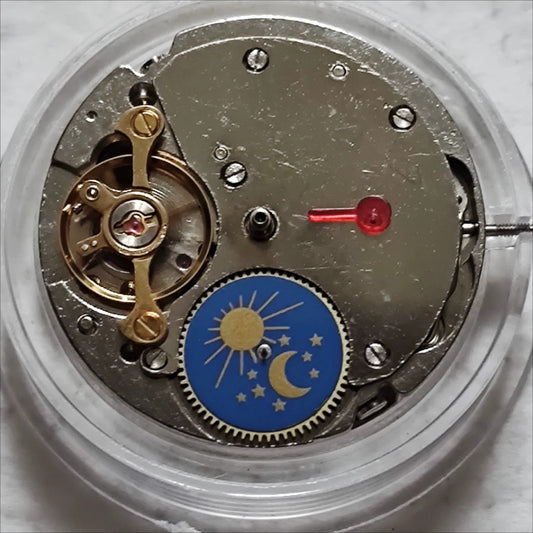 China Made 7120 mechanical watch with moon phase at 6 o'clock and bare wheel at 9 o'clock, elegant design.