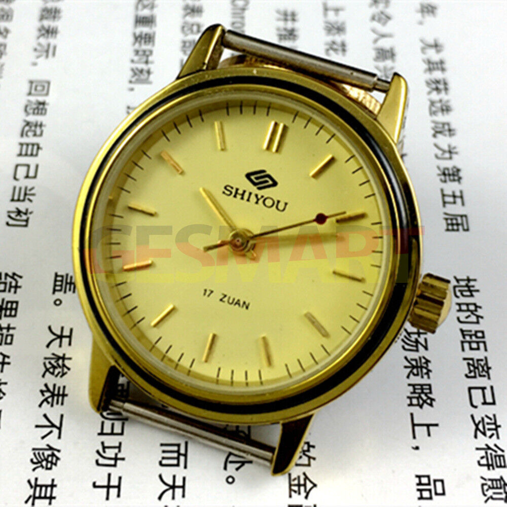 34mm manual mechanical watch with 17 jewels, golden dial, and round gold case for classic style.