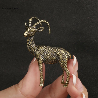 Solid copper goat trinket, vintage hand-carved bronze figurine for watch accessory display.