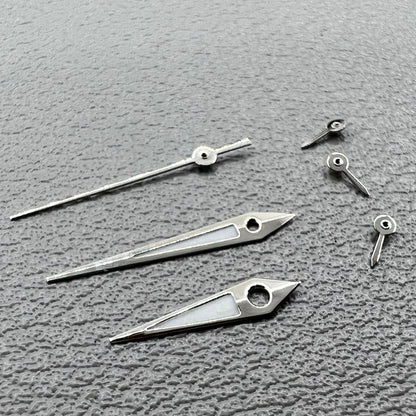 Set of 2 silver-trimmed green lume arrow-shaped watch hands for VX3J, VX9J, VX7J, VX3N, VX9N movements.