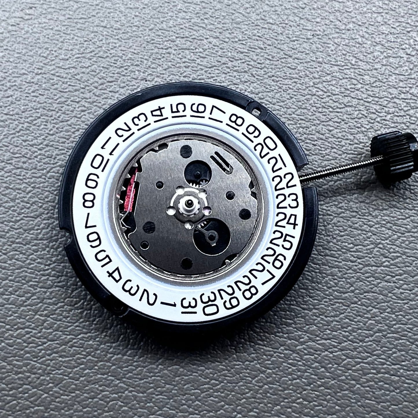 Swiss ETA 804.112 quartz watch movement showing precise 3 hands mechanism for accurate timekeeping.