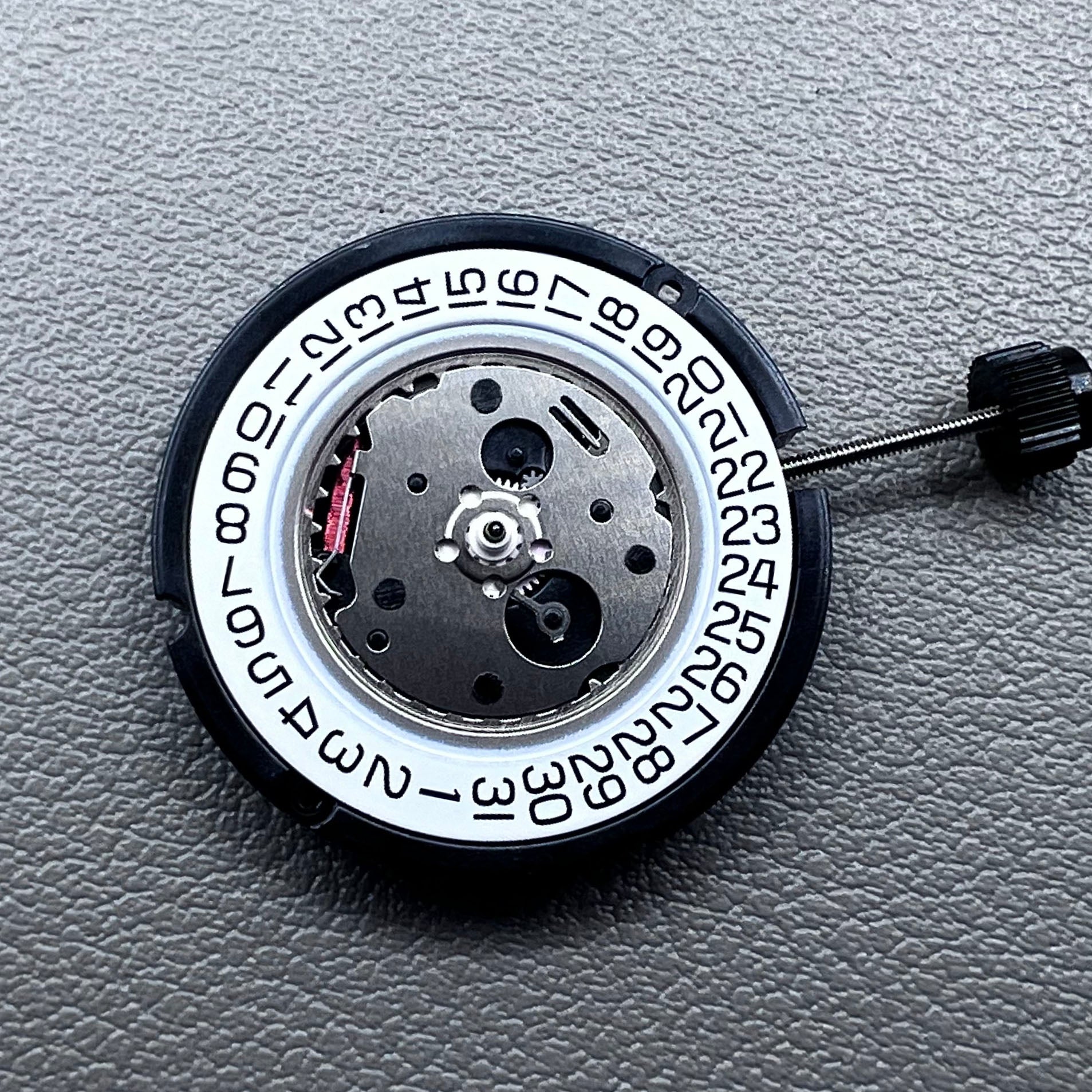 Swiss ETA 804.112 quartz watch movement showing precise 3 hands mechanism for accurate timekeeping.