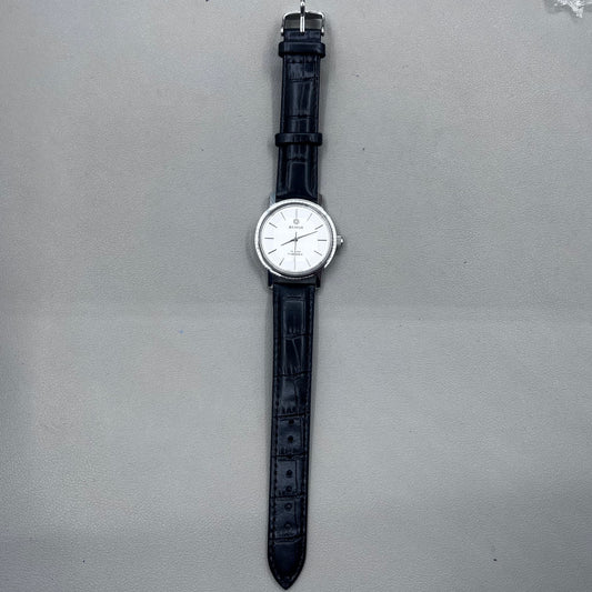 37mm China manual mechanical watch with black strap, silver dial, 19 jewels, shock-resistant design.