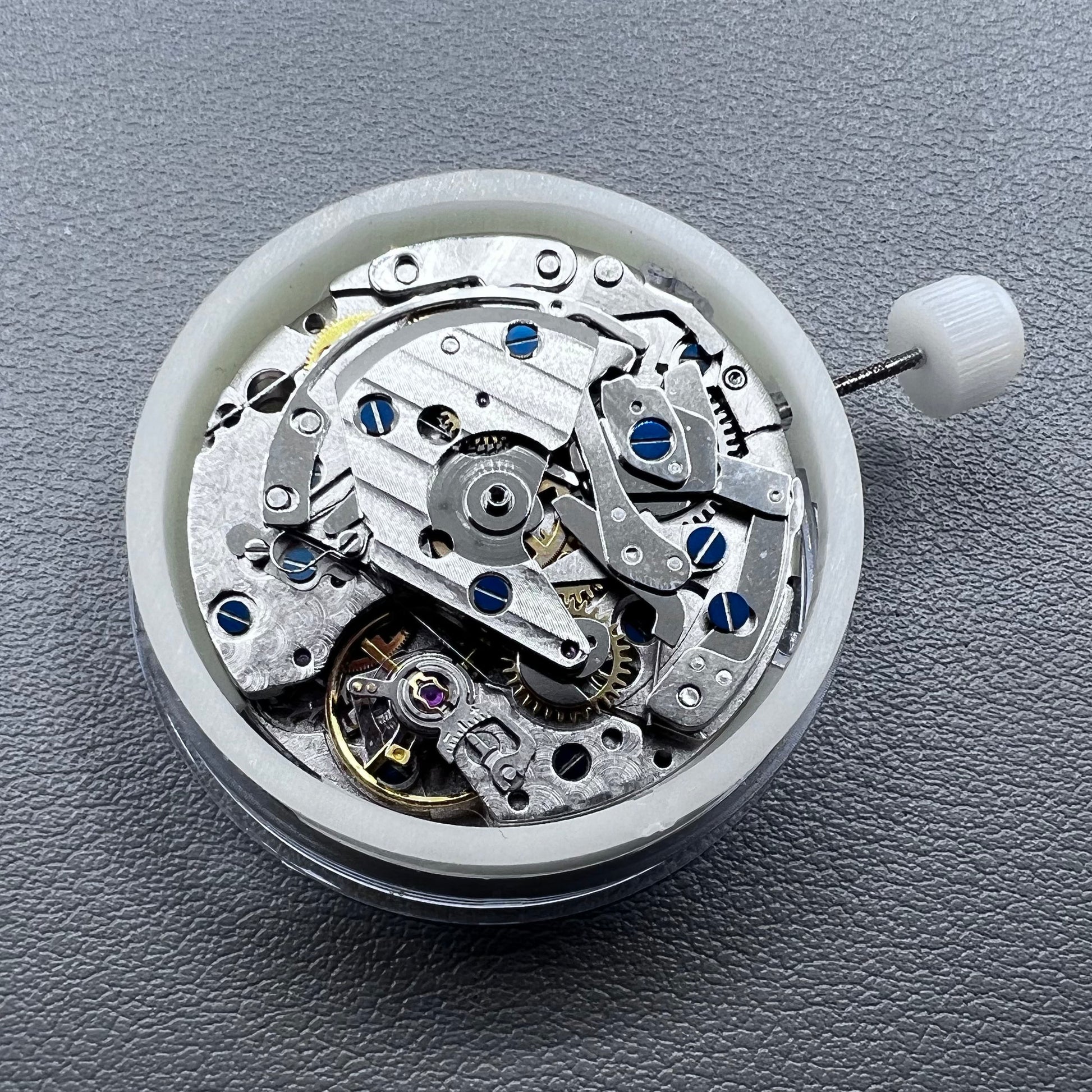 Close-up of Chinese 7750 automatic chronograph movement with day date at 3, ETA 7750 style mechanism