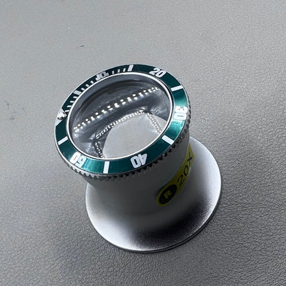 Jewelers 20X Green Loupe Magnifier with premium aluminum frame for detailed watch accessory inspection.