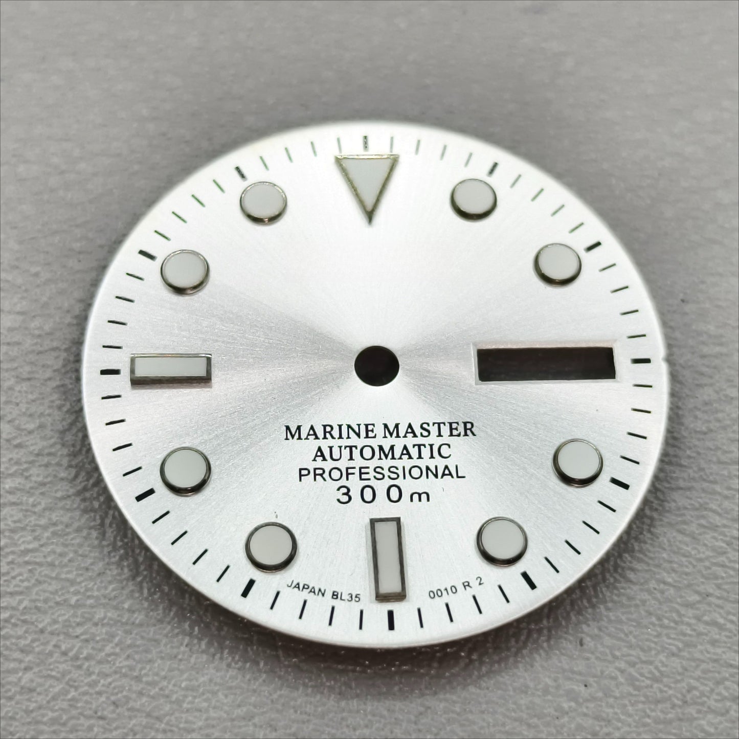 watch dial with S logo