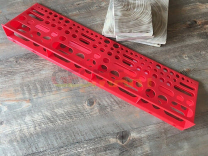 Wall-mounted hardware board with screwdriver and pliers storage for organized tool hanging.