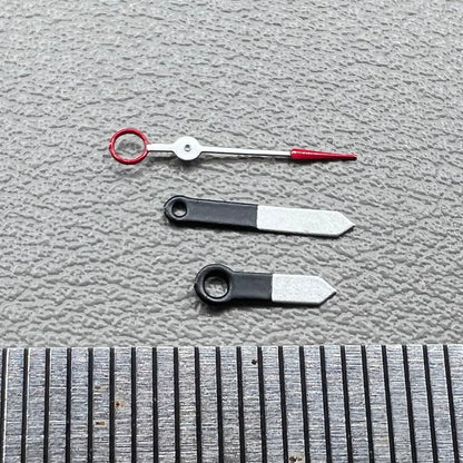 Set of black and white painted trim arrow-shaped watch hands without lume for Ronda 515, ideal for precise timekeeping.