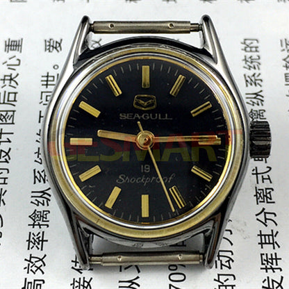 Seagull black case ladies watch with golden nail markers, shock-resistant manual mechanical movement design.
