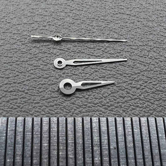 Hollow silver trim watch hands set for NH05 NH06 movement, compatible with watch repairs and customization.
