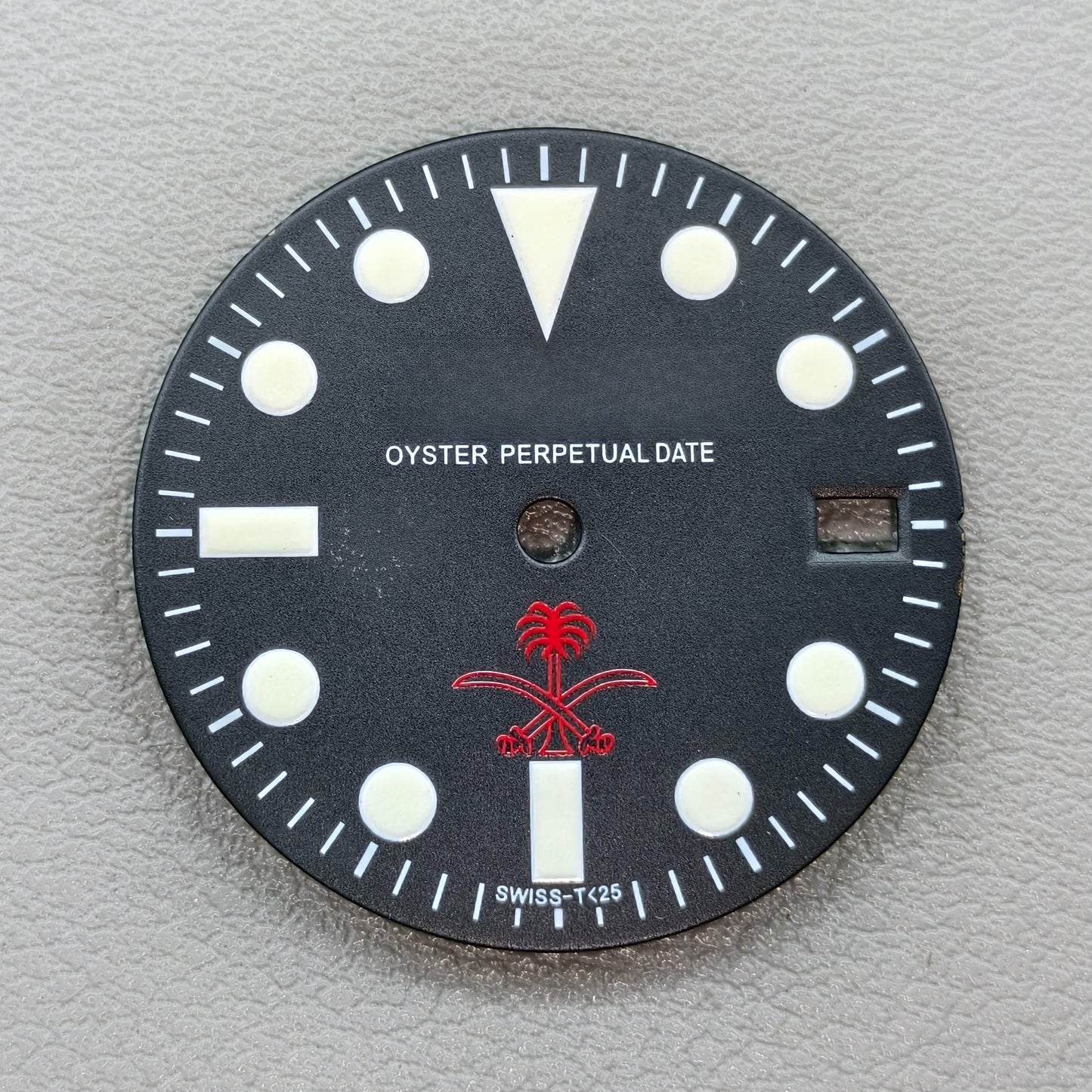 watch dial with R logo