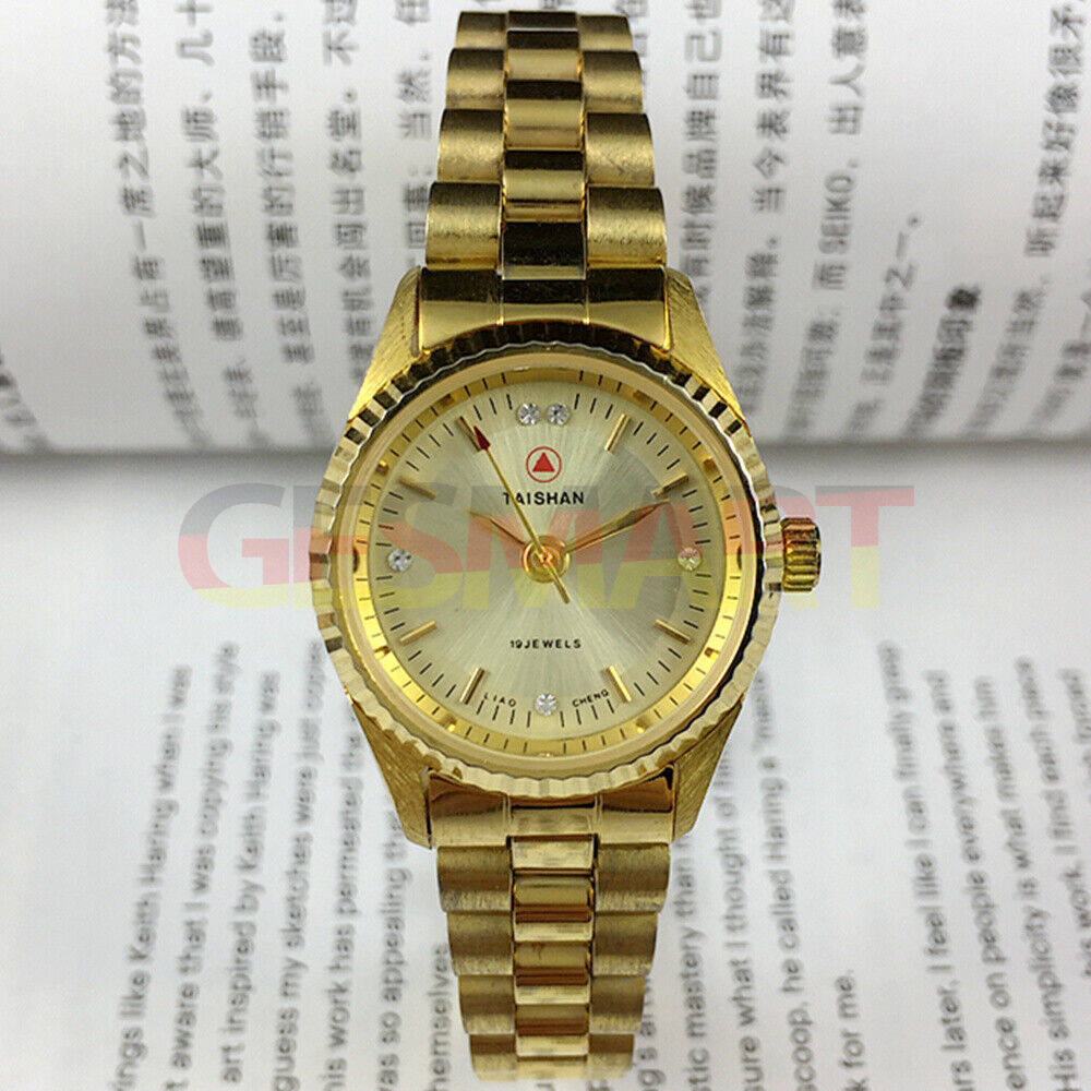 27mm Lady manual mechanical watch, golden dial with 19 jewels and nail markers.