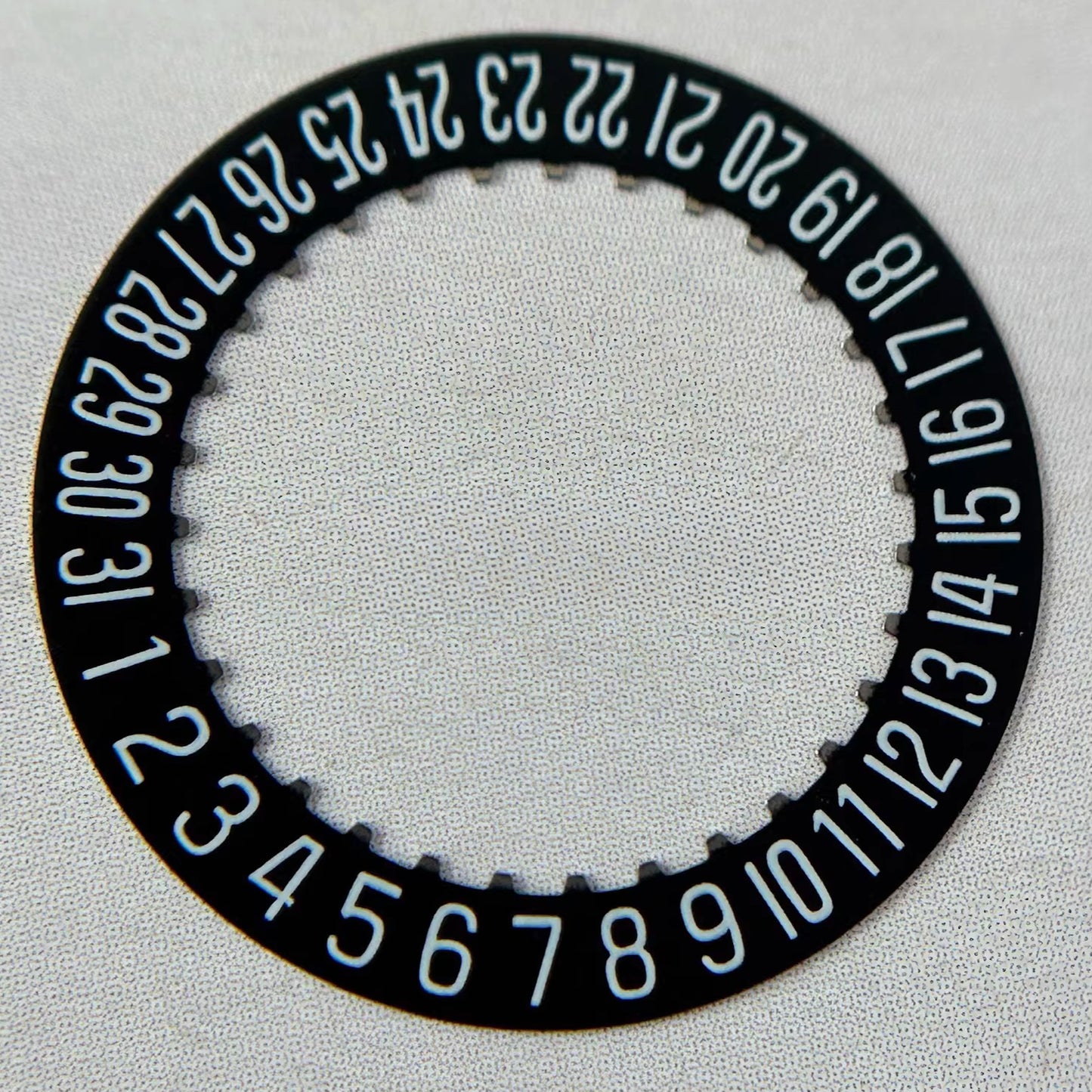 Black date disk wheel with date at 6 o'clock for Swiss ETA2000 watch movement.