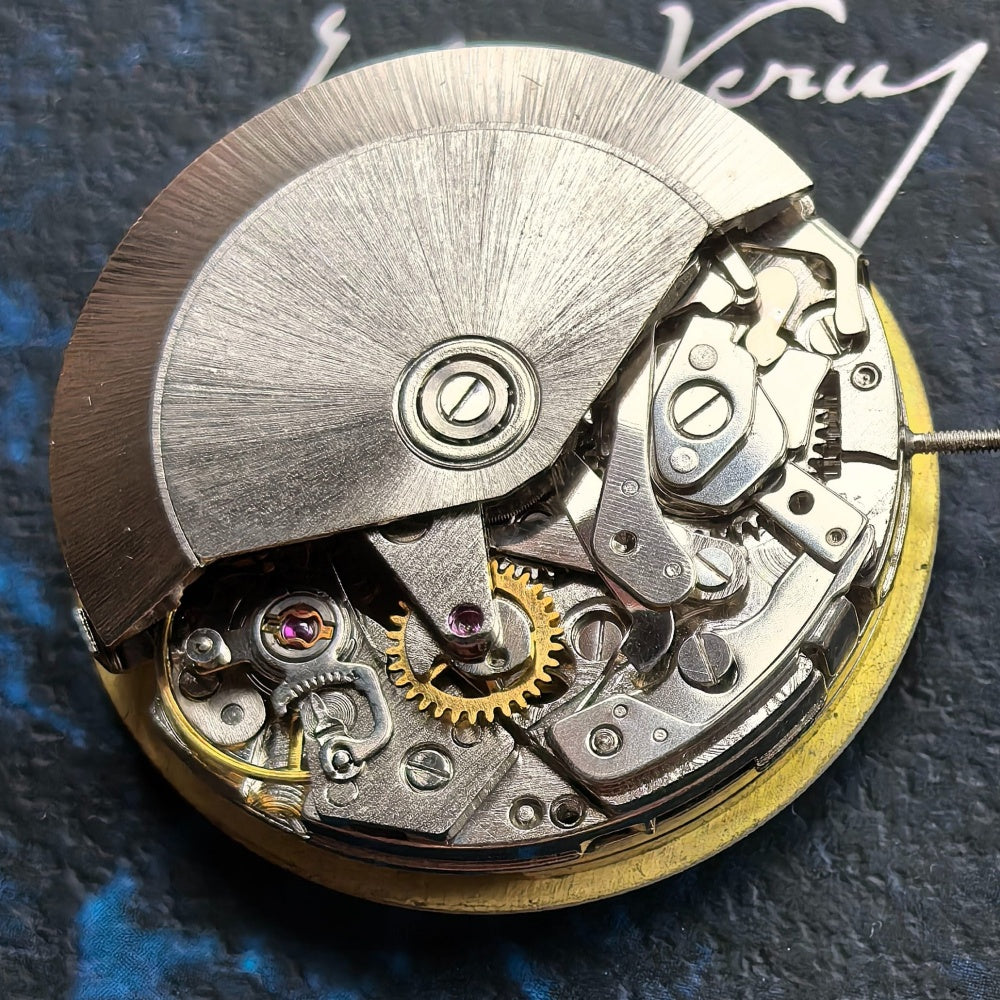 Chinese Dandong 7750 watch movement showcasing big date at 12 and small seconds at 9 in high detail.
