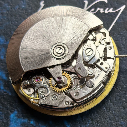 Chinese Dandong 7750 watch movement showcasing big date at 12 and small seconds at 9 in high detail.
