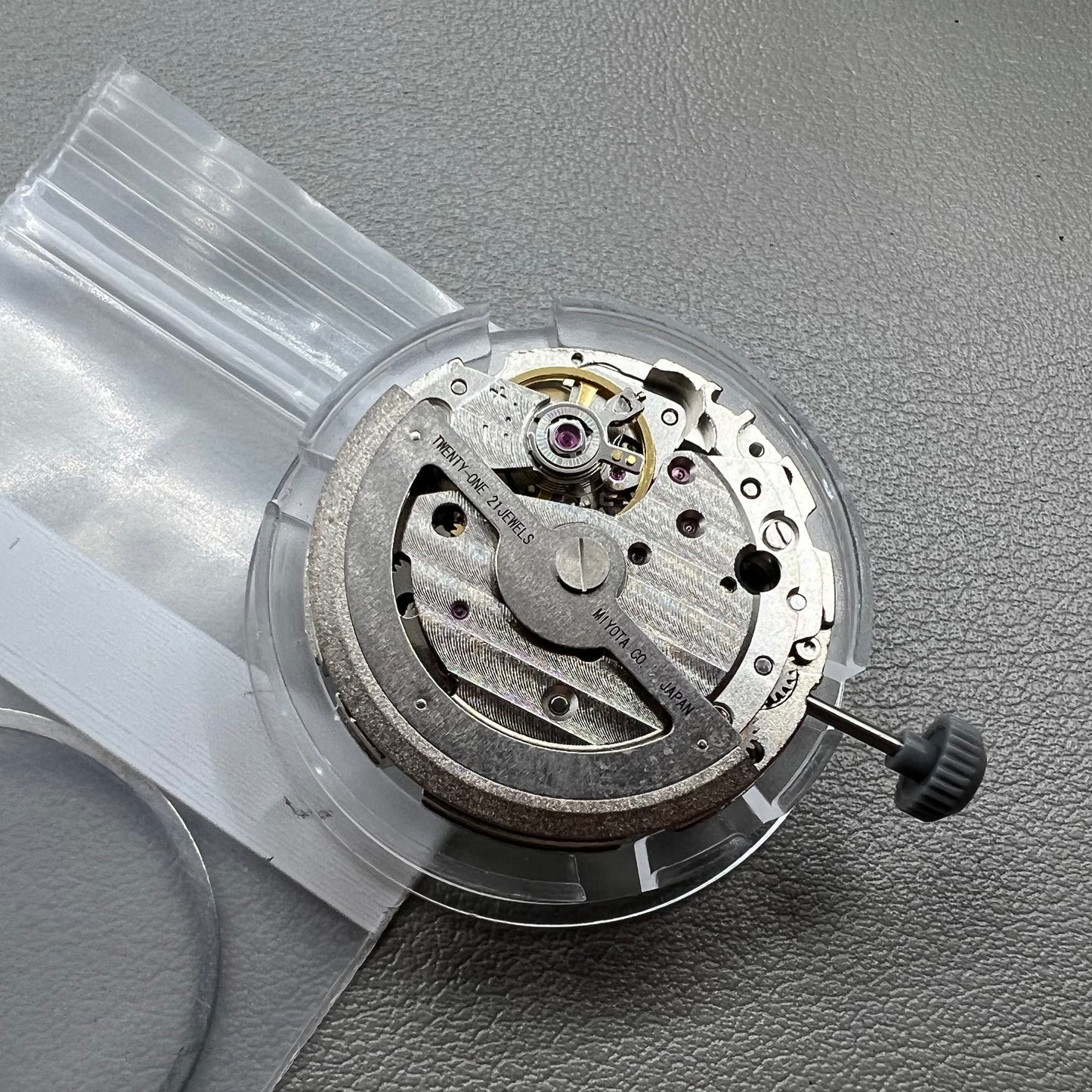 Japan Miyota 8218 automatic watch movement with date at 9 o'clock and two hands, precision timekeeping.
