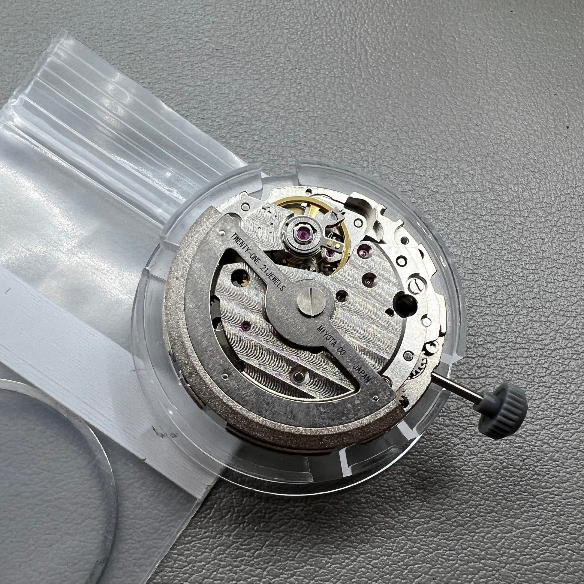 Japan Miyota 8218 automatic watch movement with date at 9 o'clock and two hands, precision timekeeping.