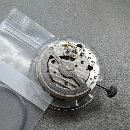 Japan Miyota 8218 automatic watch movement with date at 9 o'clock and two hands, precision timekeeping.